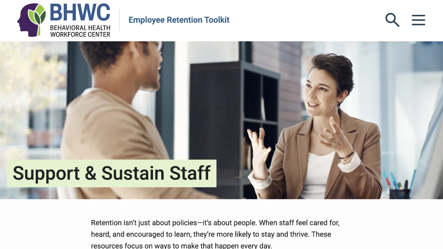 A woman and a man in an office setting discussing supporting and sustaining staff